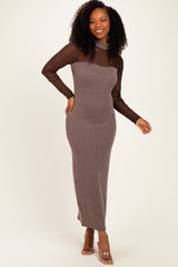 woman wearing a brown ribbed maxi dress with long sheer sleeves and a fitted silhouette