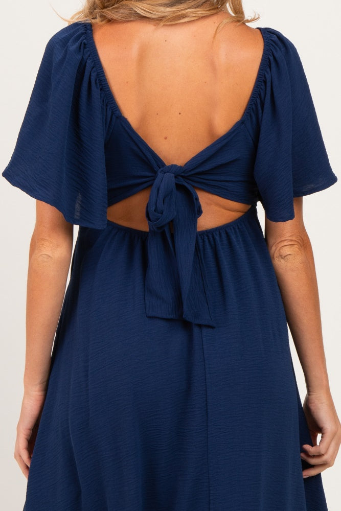 maternity wear in navy blue with a back tie closure and short flutter sleeves