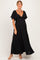woman wearing a black maternity maxi dress with flutter sleeves and a fitted bodice, showing a baby bump