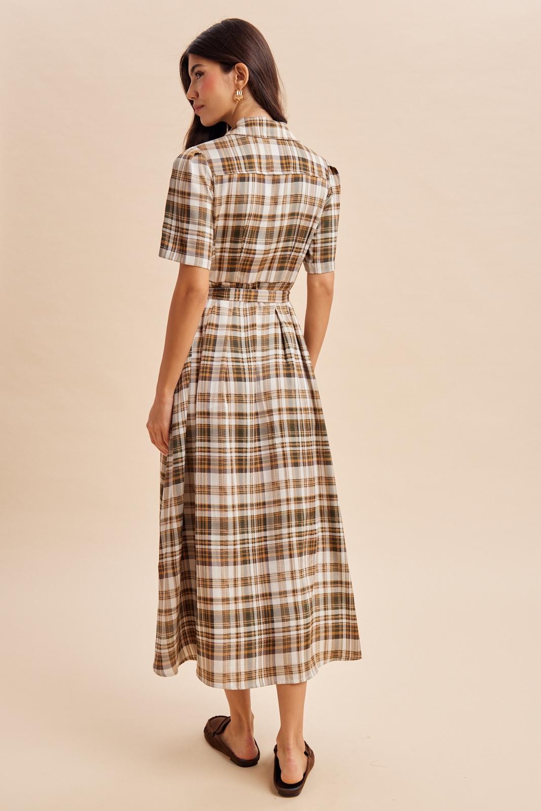 woman wearing a brown and white plaid midi dress with a belted waist and short sleeves, seen from the back