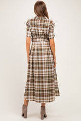 woman wearing a brown and cream plaid maternity dress with a tie waist, shown from the back