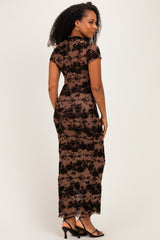 woman wearing a brown floral lace maxi dress with a fitted silhouette and short sleeves