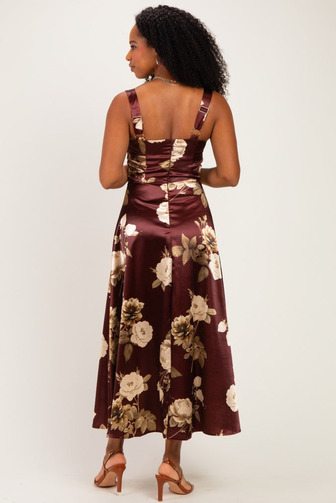 woman wearing a burgundy floral midi dress with thick straps and a fitted bodice, showing the back view