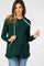 woman wearing a dark green maternity hoodie with a white drawstring and relaxed fit
