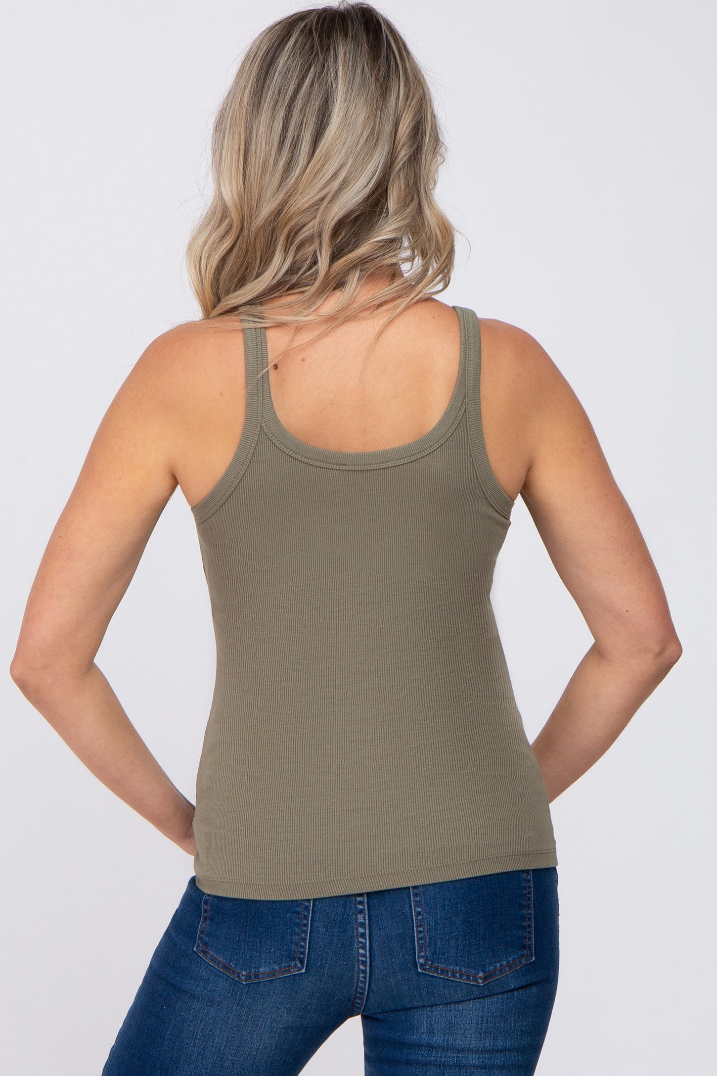 woman wearing a light olive green ribbed maternity tank top, viewed from the back