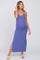 woman wearing a purple ribbed maternity maxi dress with a side slit and her baby bump visible