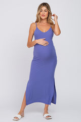 woman wearing a purple ribbed maternity maxi dress, showing her baby bump with a side slit