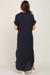 woman wearing a navy blue maternity maxi dress with short sleeves and side slits