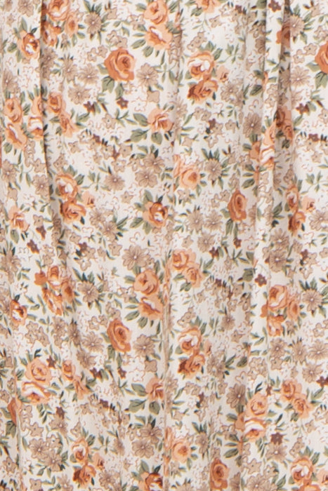 floral print maternity dress in soft tones of orange and cream, designed for comfort and style during pregnancy