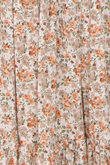 floral print fabric in soft peach and beige hues with gathered ruffle detailing
