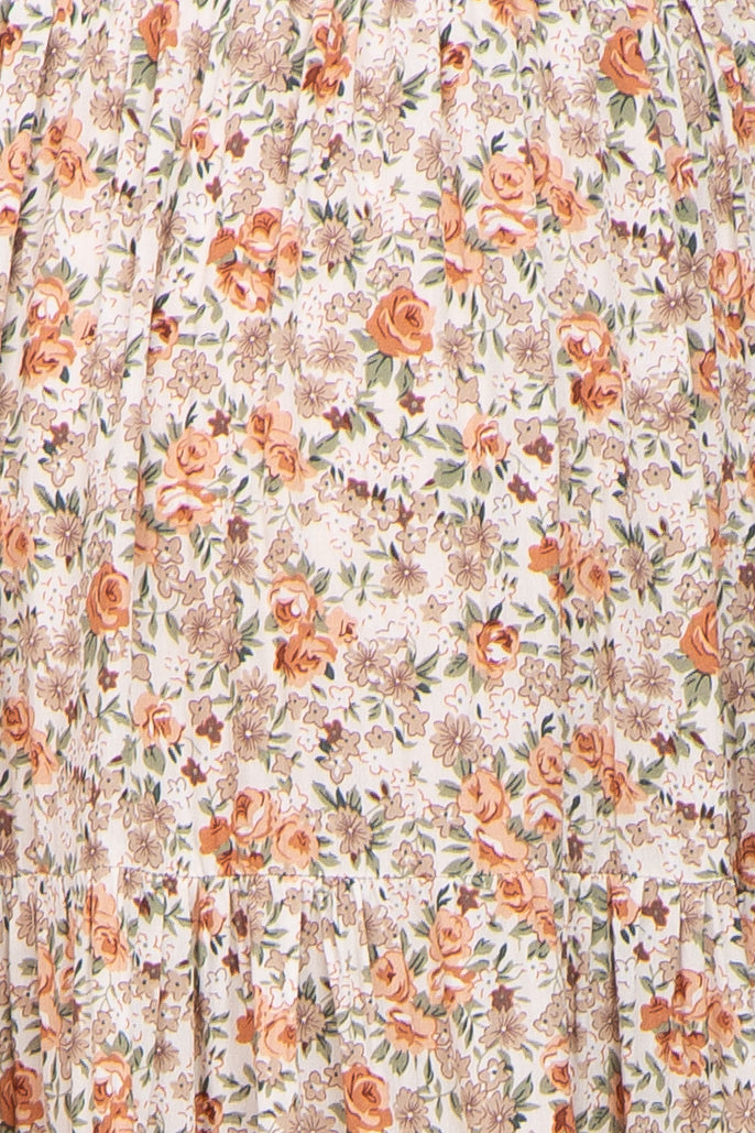 maternity wear floral print dress featuring orange and cream hues with ruffle hem detail