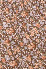 close-up of brown floral print maternity fabric with pink and lavender flowers