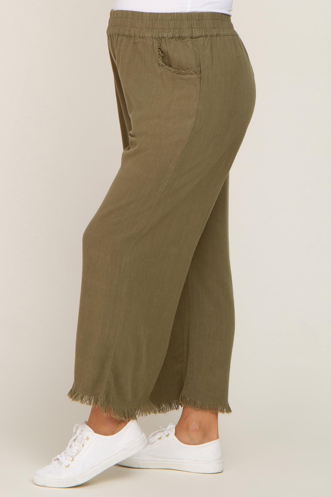 maternity wear in olive green wide-leg pants with frayed hem and elastic waistband