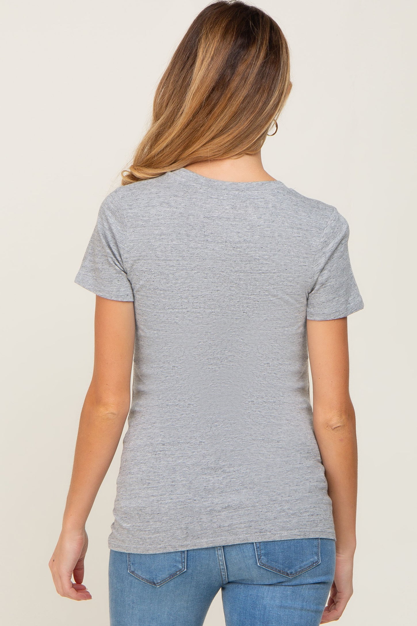 woman wearing a grey short sleeve maternity t-shirt, with a fitted silhouette, from the back