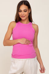 woman wearing a bright pink ribbed maternity tank top and holding her baby bump