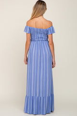 woman wearing a blue striped off-shoulder maternity maxi dress with a ruffled hem and flowing silhouette