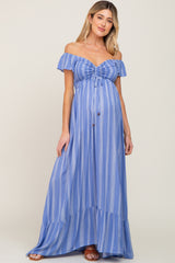 woman wearing a light blue striped off-the-shoulder maternity maxi dress with a baby bump visible
