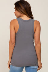 woman wearing a grey maternity tank top with a fitted style, viewed from the back