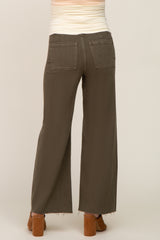 woman wearing olive green maternity wide-leg pants, seen from the back with two pockets visible