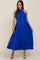 woman wearing a pleated royal blue halter neck maternity dress with a tie waist and a flowing skirt
