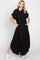 woman wearing a black button-up maxi dress with short sleeves and side pockets