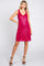 woman wearing a hot pink sleeveless sequin dress with a v-neckline and a relaxed fit