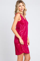 woman wearing a sleeveless hot pink sequin party dress with a relaxed fit