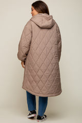woman wearing a long beige quilted maternity coat with a hood, viewed from the back