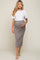 woman wearing a white short sleeve top and a gray ribbed maternity skirt, showcasing her baby bump