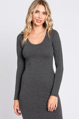 woman wearing a dark gray long sleeve bodycon dress with a scoop neckline