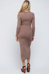 woman wearing a brown striped long sleeve maternity dress, showing a baby bump, with a form-fitting silhouette