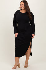 woman wearing a black ribbed long sleeve dress with a side slit and smiling