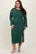 woman wearing a dark green ribbed plus size midi dress with long sleeves and a side slit
