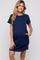 woman wearing a navy blue short sleeve maternity dress with pockets and a visible baby bump