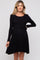 woman wearing a black long sleeve maternity dress with a tie waist and flared skirt, showing her baby bump