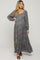 woman wearing a floral maternity maxi dress with long sleeves and a square neckline, showcasing her baby bump