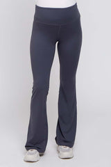 woman wearing dark gray maternity active flare pants with a wide waistband