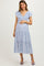 woman wearing a blue floral maternity dress with ruffled sleeves and a visible baby bump