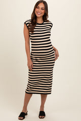 woman wearing a black and beige striped maternity dress with short sleeves and a form-fitting silhouette