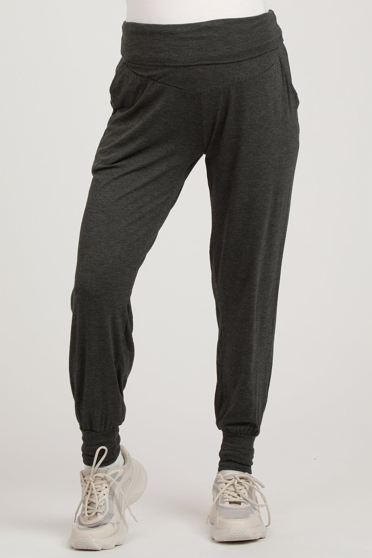 woman wearing dark gray maternity jogger pants with a wide waistband and gathered cuffs