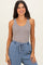 woman wearing a ribbed gray tank top paired with light blue drawstring pants