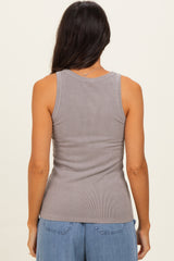 woman wearing a gray ribbed tank top, showing the back view and styled with casual jeans