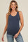 woman wearing a navy ribbed maternity tank top and jeans with a visible baby bump