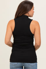 woman wearing a black sleeveless maternity top with a high neckline, viewed from the back