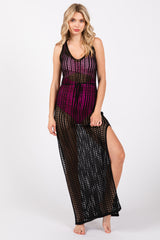 woman wearing a black and pink maxi cover-up with a sheer design and side slit