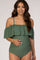 woman wearing a green off-the-shoulder maternity swimsuit with ruffle details and a visible baby bump