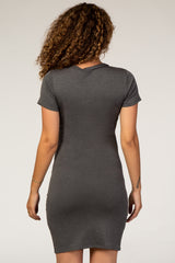 woman wearing a charcoal gray short sleeve maternity dress, viewed from the back